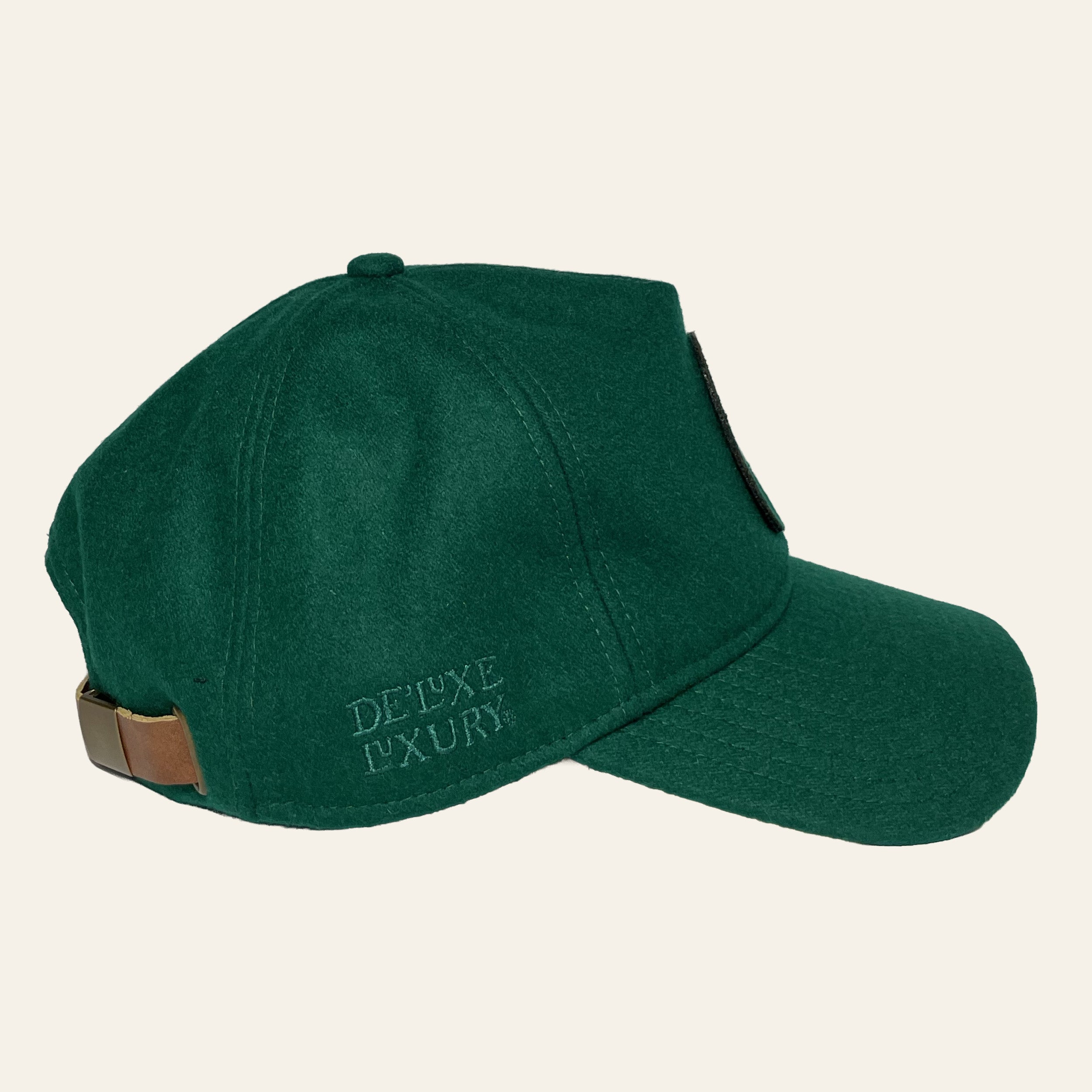 De'Luxe Luxury Origins wool blend hat  right side view in emerald with leather like strap, brass bucklet and embroidery.